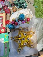 Star tree-topper, loose ornaments, C-9 light string visible