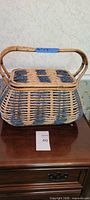 Closed basket front view showing shape, color pattern, handles