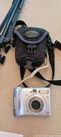 Canon PowerShot A540 camera, soft pouch, folded music stand legs