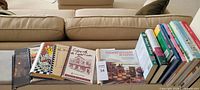 Row of cookbooks laid flat showing front covers