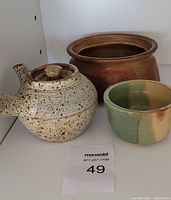 Front view of all three pottery pieces together