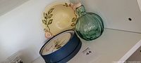Overall lot showing yellow bowl, green glass vase, boxed Spruce plates
