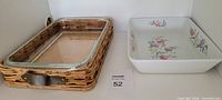 clear glass casserole in wicker tray and white floral ceramic casserole side-by-side