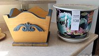 wood planter and ceramic planter side by side on counter