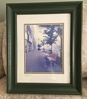 Street bench print in dark green frame with matting