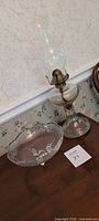 Lantern and bowl side by side on table