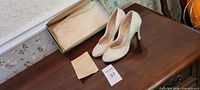 overall view of shoes, box and receipt on table