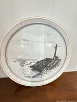 Front view showing entire round lighthouse print and frame