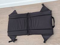 Folded out view showing three padded sections and corner flaps