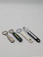 All four bottle openers lined up