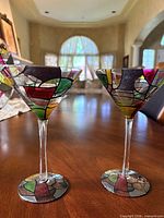 Front view of both martini glasses showing painted pattern detail
