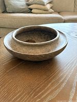 Angled view of soapstone bowl showing shape and rim