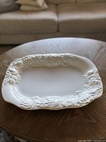front view of platter showing embossed fruit border