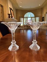 Front view of both crystal compotes standing on table