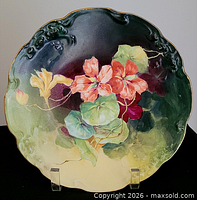 Front view showing entire floral design and gold rim
