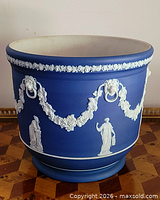 Full view of blue jasperware jardiniere showing relief decoration and proportions