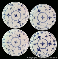 Front view of four Blue Fluted plates