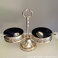 Full view of silver-plated double condiment server with cobalt liners and spoons