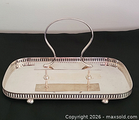 three-quarter view showing tray, handle, rim, feet