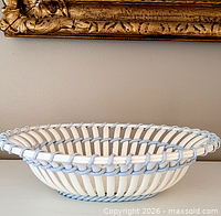 Top angled view of the Wedgwood creamware openwork bowl showing lattice design and blue edging