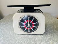 Front view of CIBA Jolly kitchen scale showing dial