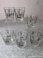 Six tumblers showing full set on display stand