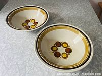 Two matching Haniwa Carnival stoneware bowls on tabletop
