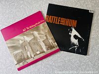 Front covers of both U2 albums
