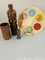 Overall lot showing Ti-toki bottle, tiki glass, Kon-Tiki shaker, coaster tray set