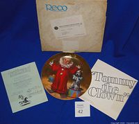 Front view of plate with box, COA, brochure