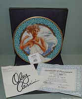Plate displayed in original box with certificate and brochure