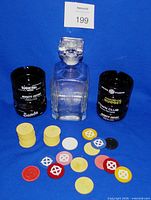 Full lot showing ashtrays stacked, decanter, and poker chips
