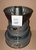 Stacked view of bundt pan atop three nested springform pans