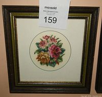 Front view of first framed petit point showing multicolour roses