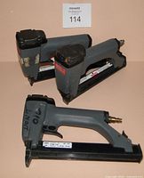 Three Senco staple guns side view showing overall form and wear
