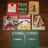 All nine cookbooks laid out on floor