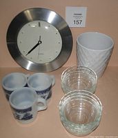 Overview of clock, pot, mugs and bowls