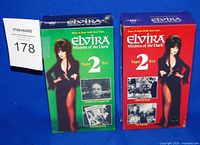 Front view of two sealed Elvira double VHS sets showing artwork and titles