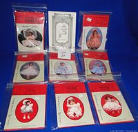 All nine patterns laid out in protective sleeves