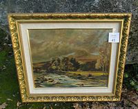 Front view of framed oil landscape painting