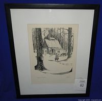 Framed lithograph in black frame with mat