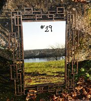 Front view of mirror with geometric metal frame