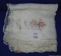 Tablecloth folded to show crochet and embroidery