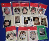 All thirteen pattern envelopes and booklets arranged on blue background
