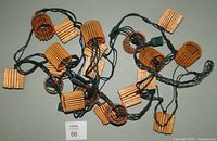 Both string lights coiled showing bamboo lantern covers