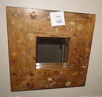 Full view of square wood mirror with pressed flowers