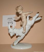 Front view of Wallendorf porcelain figurine showing cherub riding goat with gold hooves
