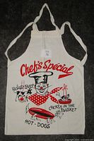 Front view of apron showing full design and straps