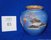 Front view of blue moriage vase with landscape design