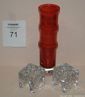 Full view of red Seda vase and two clear cube candle holders